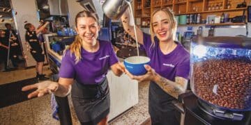 Merlo Bowen Hills team members Sarah Egan (left) and Sarah Dufault were pleased to serve fresh coffee for a cause on International Women’s Day.