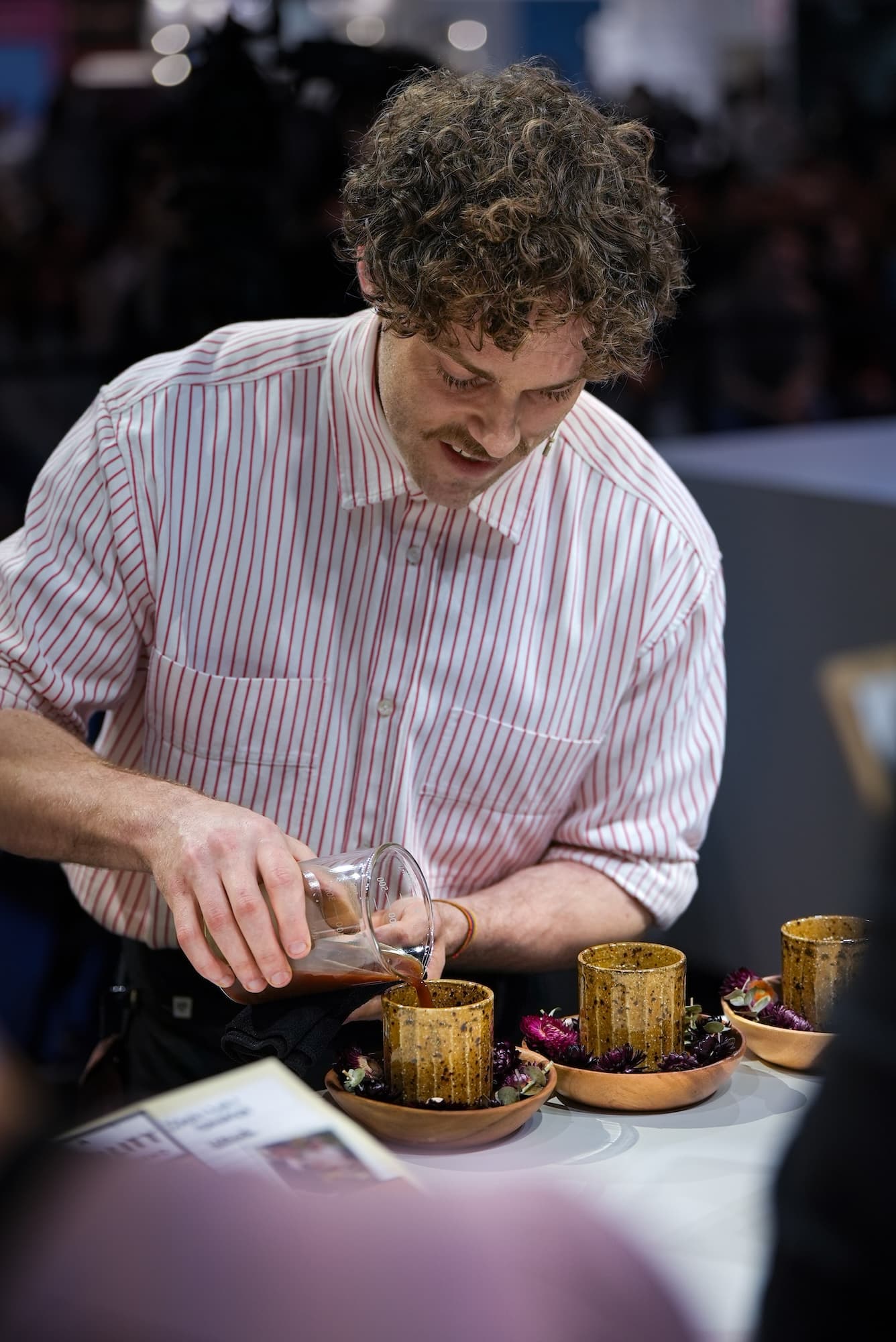 Jack presenting his signature drink course in the final round. Image: Specialty Coffee Association.