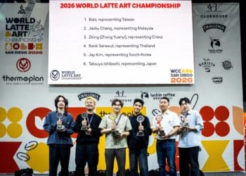 Bala (third from left) celebrates winning the 2026 WLAC with the other podium finishers.