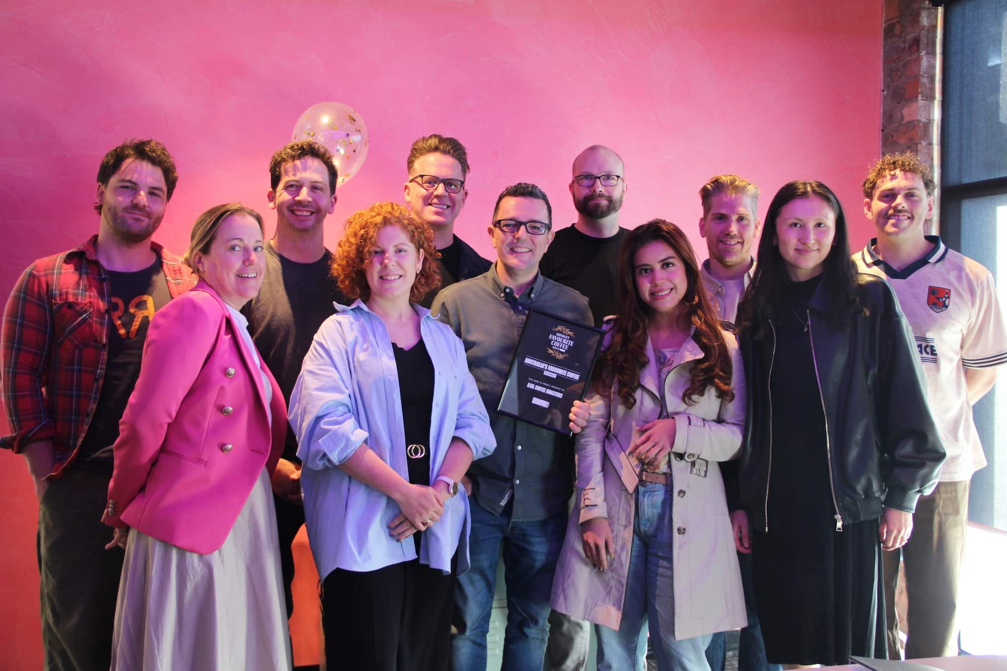 The Axil Coffee Roasters board celebrate being named Australia's favourite coffee.